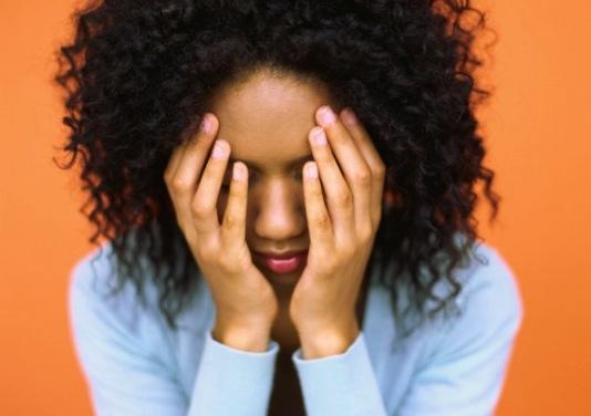 woman-with-curly-hair-looking-sad